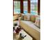 Bright sunroom featuring large windows with views of the outdoor swimming pool at 5949 Willow Bend Dr, Avon, IN 46123