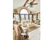 Bright sunroom with many windows, vaulted ceiling, ceiling fan, and cozy seating area at 5949 Willow Bend Dr, Avon, IN 46123
