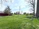 Expansive backyard with lush green grass and a storage shed on the property at 5967 Oak Hill East Dr, Plainfield, IN 46168