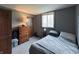 Comfortable bedroom with neutral walls, carpet flooring, and bright window at 5967 Oak Hill East Dr, Plainfield, IN 46168