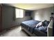 Comfortable bedroom with neutral walls, carpet flooring, and bright window at 5967 Oak Hill East Dr, Plainfield, IN 46168