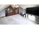 A bonus room with an adjacent office space with a modern ceiling fan and gray walls at 5967 Oak Hill East Dr, Plainfield, IN 46168