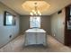 Bright dining room with carpet and natural light, with a view into the kitchen at 5967 Oak Hill East Dr, Plainfield, IN 46168