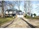 Inviting two-story home with a basketball hoop, attached garage, and a well-manicured lawn at 5967 Oak Hill East Dr, Plainfield, IN 46168