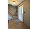 Inviting foyer with tiled floor, staircase and natural wood trim at 5967 Oak Hill East Dr, Plainfield, IN 46168