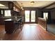 Eat-in kitchen with an island, pendant lighting, and wood-look flooring at 5967 Oak Hill East Dr, Plainfield, IN 46168