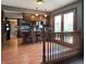 Open kitchen with an island, granite countertops, and wood cabinets near the patio door at 5967 Oak Hill East Dr, Plainfield, IN 46168