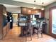 Kitchen with granite counters, an island, and modern backsplash at 5967 Oak Hill East Dr, Plainfield, IN 46168