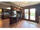 Kitchen featuring an island with bar stools and French doors leading to patio at 5967 Oak Hill East Dr, Plainfield, IN 46168