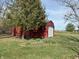 Exterior view of the large shed at this home, surrounded by grass and trees at 5967 Oak Hill East Dr, Plainfield, IN 46168