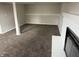 This basement offers neutral paint, carpet and a decorative fireplace at 6044 Granner Dr, Indianapolis, IN 46221