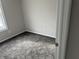 Bedroom featuring carpeted floors, double hung window, and neutral walls at 6044 Granner Dr, Indianapolis, IN 46221