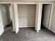 Carpeted bedroom with multiple closet doors and closet with wire shelving at 6044 Granner Dr, Indianapolis, IN 46221