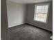 Bedroom featuring a double hung window, carpeting, and neutral walls at 6044 Granner Dr, Indianapolis, IN 46221