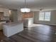 Open floor plan kitchen boasts an island and stainless steel appliances at 6044 Granner Dr, Indianapolis, IN 46221