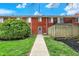 Townhouse with a well-manicured backyard, featuring a brick exterior and patio at 6515 Park Central Way # B, Indianapolis, IN 46260
