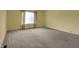 Large bedroom with neutral carpet and a large window at 6515 Park Central Way # B, Indianapolis, IN 46260