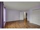 Laminate floors and purple walls in this well lit bedroom at 6515 Park Central Way # B, Indianapolis, IN 46260