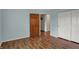 Bedroom with wood floors and an open door with view of a storage area at 6515 Park Central Way # B, Indianapolis, IN 46260
