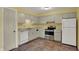 Kitchen featuring neutral walls, stainless appliances, and ample cabinet space at 6515 Park Central Way # B, Indianapolis, IN 46260