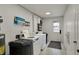 A communal laundry room features modern washing machines and a dryer for convenient clothes care at 6515 Park Central Way # B, Indianapolis, IN 46260