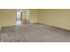 Spacious living room with carpet and view to dining area at 6515 Park Central Way # B, Indianapolis, IN 46260