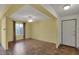 Bright living room featuring neutral walls, a ceiling fan, and a large window at 6515 Park Central Way # B, Indianapolis, IN 46260