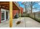 The patio features a concrete surface and brick exterior with a dark balcony above at 6515 Park Central Way # B, Indianapolis, IN 46260