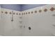 Shower with white tile and colorful trim at 6515 Park Central Way # B, Indianapolis, IN 46260