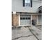 Attached garage with brick facade, providing convenient parking and storage space at 6808 Summer Time Dr, Indianapolis, IN 46226