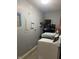 Functional laundry room featuring modern washer, dryer, and storage shelving at 6808 Summer Time Dr, Indianapolis, IN 46226
