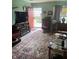 Inviting living room with a large Persian rug, entertainment center, and an abundance of natural light at 6808 Summer Time Dr, Indianapolis, IN 46226