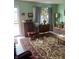 Bright living room featuring a Persian rug, comfortable sofa, and natural light at 6808 Summer Time Dr, Indianapolis, IN 46226