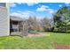 The property includes a screened porch, mature trees and a well-manicured lawn at 7233 Capel Dr, Indianapolis, IN 46259