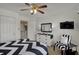 This bedroom features a black and white color scheme, TV, and neutral walls at 7233 Capel Dr, Indianapolis, IN 46259