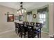 Dining room boasts a long table for entertaining, mirrors, and stylish decor at 7233 Capel Dr, Indianapolis, IN 46259