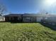 Charming single-story home boasts a well-maintained lawn and a classic brick facade at 731 W Stop 11 Rd, Indianapolis, IN 46217