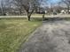 Large front yard with mature trees on a sunny day at 731 W Stop 11 Rd, Indianapolis, IN 46217