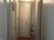 Hallway featuring neutral walls and white doors, leading to various rooms at 731 W Stop 11 Rd, Indianapolis, IN 46217