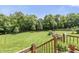 Expansive backyard featuring a well-manicured lawn, mature trees, and picturesque landscaping at 7341 Campfire Run, Indianapolis, IN 46236