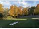 Beautiful backyard with mature trees displaying vibrant fall colors at 7341 Campfire Run, Indianapolis, IN 46236