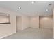 Finished basement with neutral carpeting and plenty of recessed lighting, showcasing its spacious layout at 7341 Campfire Run, Indianapolis, IN 46236