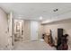 Spacious basement area with door to a utility area and what appears to be a 3/4 bathroom at 7341 Campfire Run, Indianapolis, IN 46236