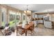 Charming dining area with large windows overlooking the backyard garden at 7341 Campfire Run, Indianapolis, IN 46236