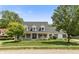Charming single Gathering home with a well-manicured lawn and inviting front porch at 7341 Campfire Run, Indianapolis, IN 46236