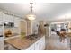 Bright kitchen boasts granite counters, stainless appliances, and an open design for easy entertaining at 7341 Campfire Run, Indianapolis, IN 46236