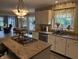 Bright kitchen with stainless steel appliances and granite countertops offers a functional and stylish space at 7341 Campfire Run, Indianapolis, IN 46236