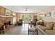 Bright living room with a brick fireplace and access to the backyard patio at 7341 Campfire Run, Indianapolis, IN 46236
