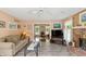 Comfortable living room with a brick fireplace, cozy sofa, and tiled floor at 7341 Campfire Run, Indianapolis, IN 46236