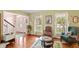 Inviting living room with hardwood floors, windows, and a staircase to the upper level at 7341 Campfire Run, Indianapolis, IN 46236